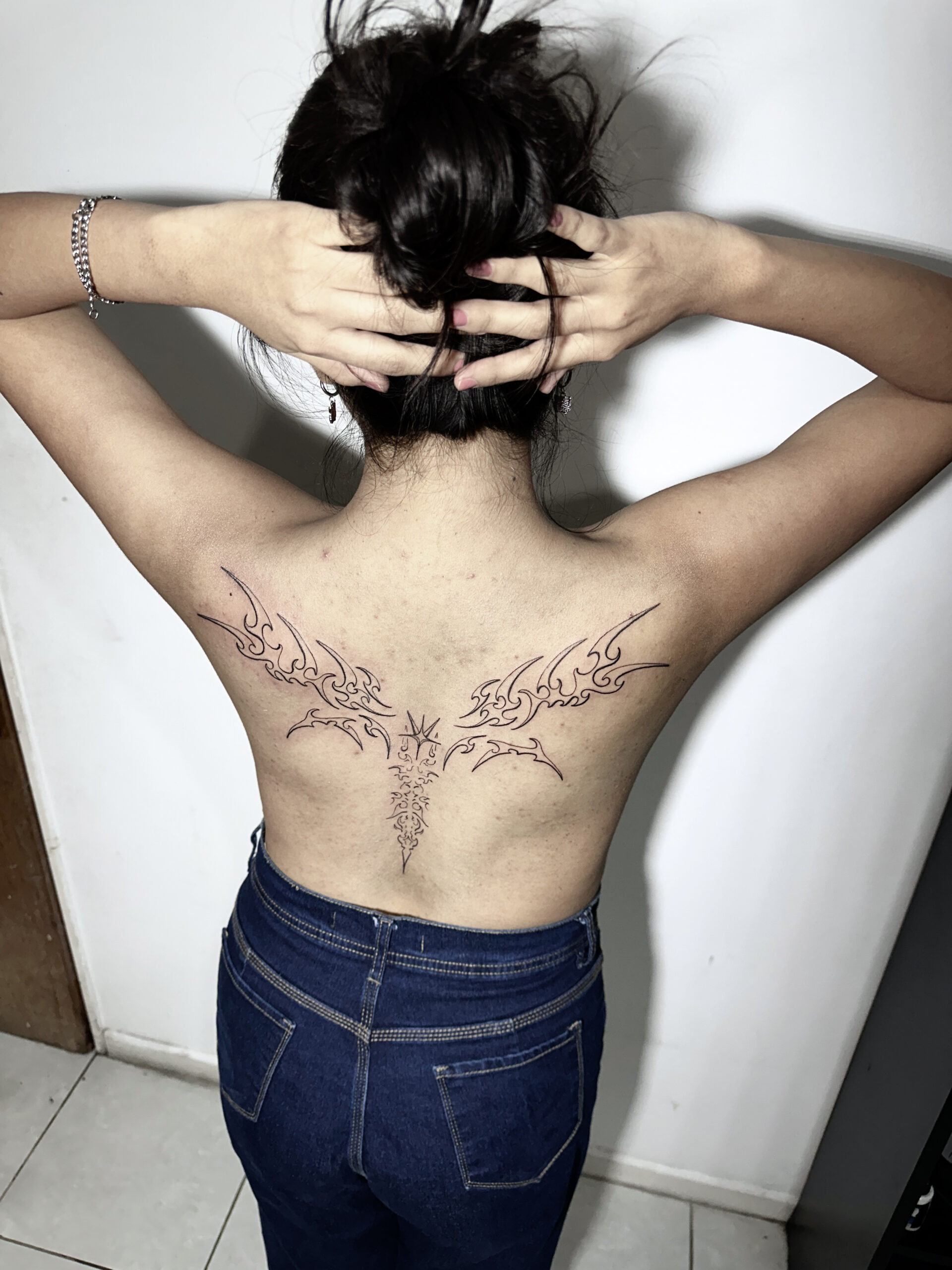 Alas Neotribal Back Tattoo